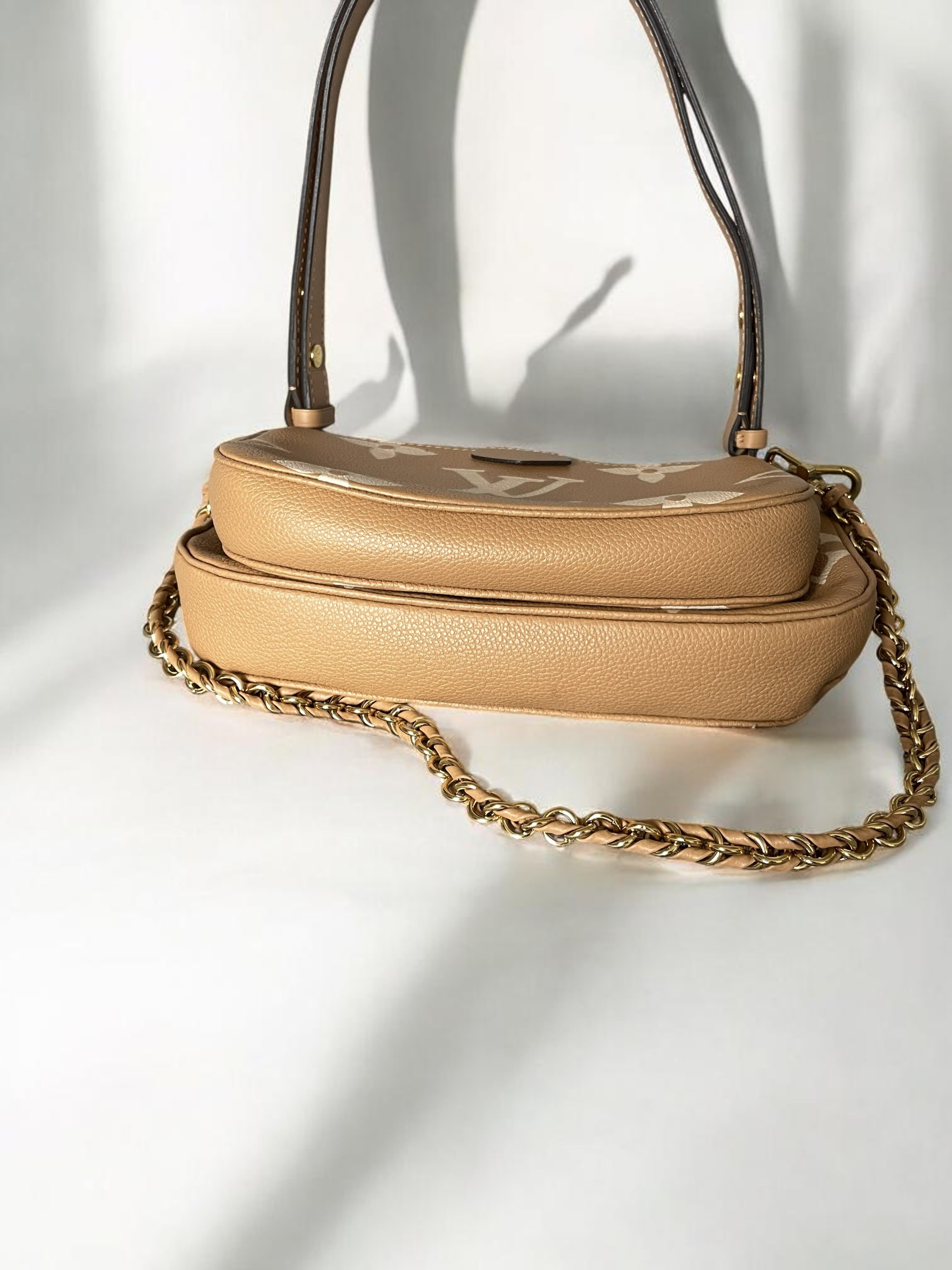 Louis Vuitton Multi Pochette Accessoires In Empreinte Leather With Large LV Monogram Print Caramel Colour